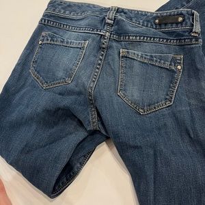 Express Medium Wash Skinny Jeans with pockets.